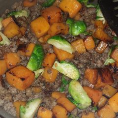 A picture of Butternut squash, Brussel sprout sausage mixture.