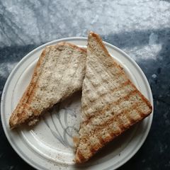A picture of Peanut butter and 'jam' toast.