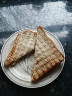 A picture of Peanut butter and 'jam' toast.