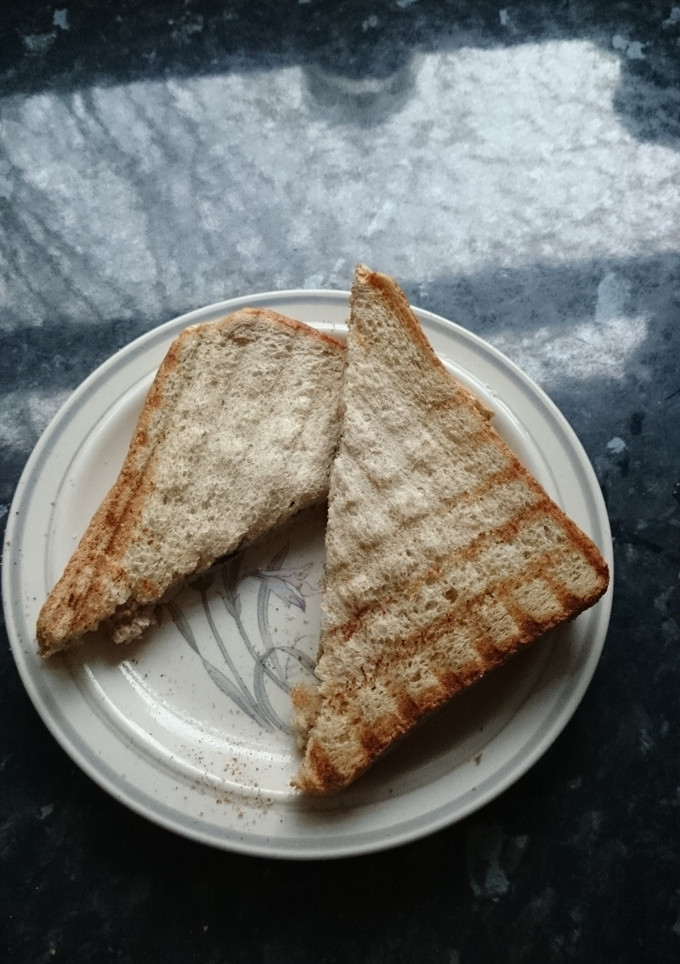 A picture of Peanut butter and 'jam' toast.
