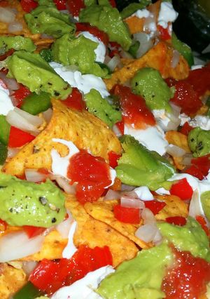 A picture of Crispy crunchy colourful nachos.