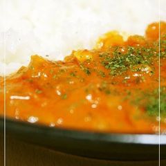 A picture of Delicious Prawns in Tomato Cream with Rice.