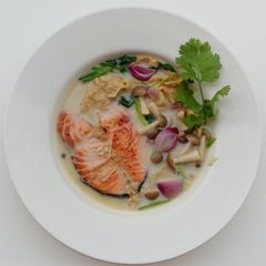 A picture of Salmon And Shimeji Mushroom In Milk Soup.