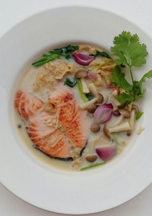 A picture of Salmon And Shimeji Mushroom In Milk Soup.