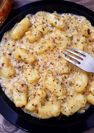 A picture of Eggless Gnocchi in Herb & Cheese Sauce.