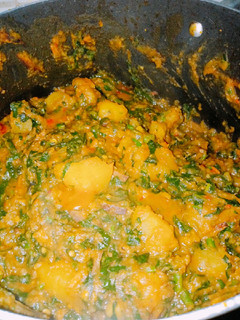 A picture of Sweet potato porridge with ugba and ugu.