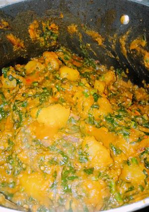 A picture of Sweet potato porridge with ugba and ugu.