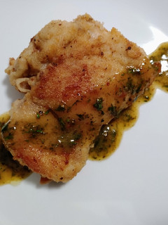 A picture of Pan-crisped chicken and fines herbes sauce.
