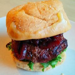 A picture of Bison Burgers with Cabernet Onions and Wisconsin Cheddar.