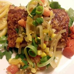 A picture of Blackened mahi mahi with corn salsa and honey glazed carrots.