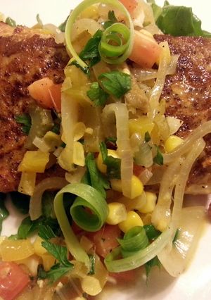 A picture of Blackened mahi mahi with corn salsa and honey glazed carrots.