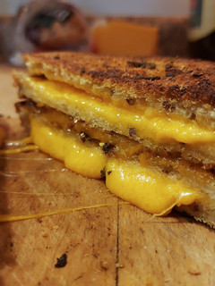 A picture of Double Stacked Herb Crusted Grilled Cheese.