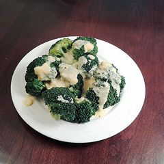 A picture of Broccoli with Hollandaise sauce.