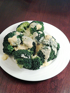 A picture of Broccoli with Hollandaise sauce.