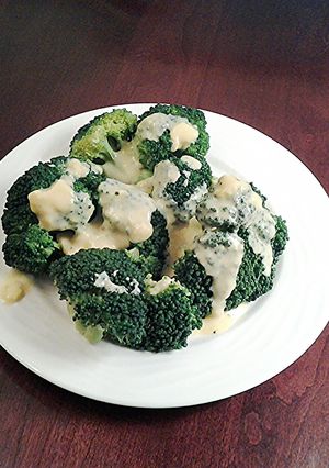 A picture of Broccoli with Hollandaise sauce.