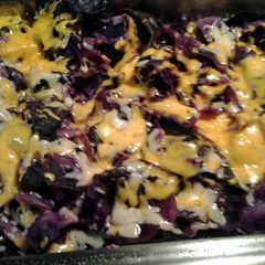 A picture of oven roasted cheesy purple cabbage.
