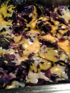 A picture of oven roasted cheesy purple cabbage.