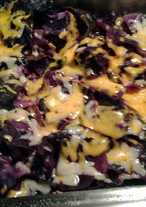 A picture of oven roasted cheesy purple cabbage.