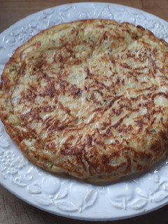 Una foto de 76. Tortilla de patata con pimienta y albahaca