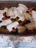 Nasello al forno con pomodorini e olive nere denocciolate