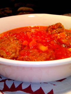 A picture of Meatballs with Italian Style Tomato Sauce.
