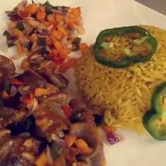 A picture of Rice with vegetables and kidney sauce.
