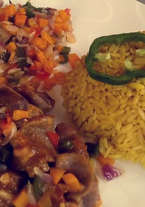 A picture of Rice with vegetables and kidney sauce.