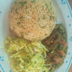 A picture of Meat gravy, steamed cabbage salad and stir fried Rice.