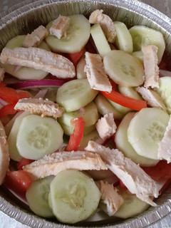 A picture of Cucumber Salad w/ Grilled Chicken.