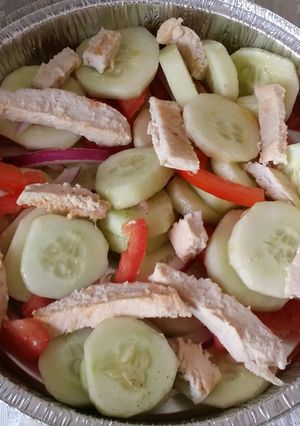 A picture of Cucumber Salad w/ Grilled Chicken.