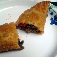 four meat empanadas A picture of four meat empanadas.