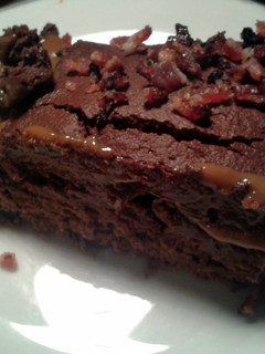 A picture of Fudgy Chocolate Cake with Salted Caramel & Maple Bacon.
