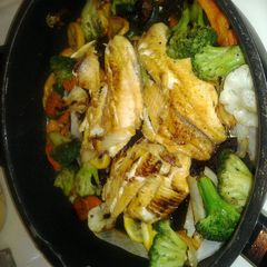 A picture of grilled lemon tilapia w/veggies.