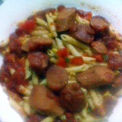 A picture of Penne Pasta with sausage.