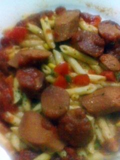 A picture of Penne Pasta with sausage.