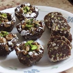 A picture of Khajur Dryfruit roll and katori.