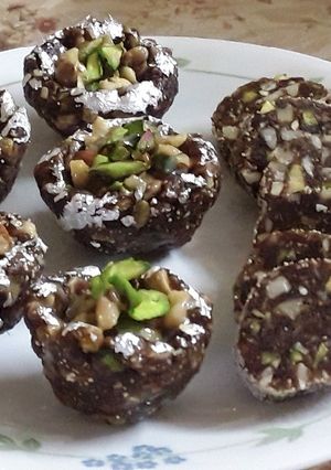 A picture of Khajur Dryfruit roll and katori.