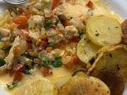 Una foto de pollo al verdeo con crema