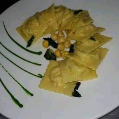A picture of This is spinach ricotta cheese ravioli.
