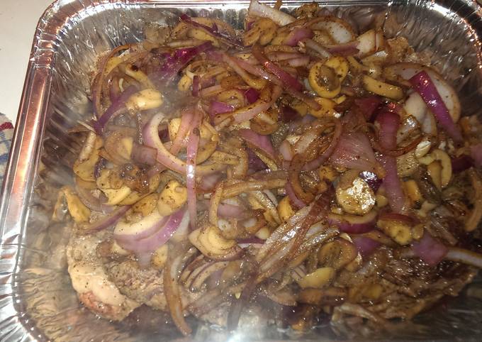 Ribeye steak smothered in onions and mushrooms