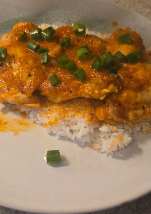A picture of Pan-Seared Chicken Thighs with Roasted Red Pepper Sauce.