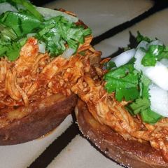 A picture of Ray's' Chicken Mole Stuffed Potatoe Skin.