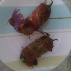 Bacon wrapped stuffed jalapeños A picture of Bacon wrapped stuffed jalapeños.
