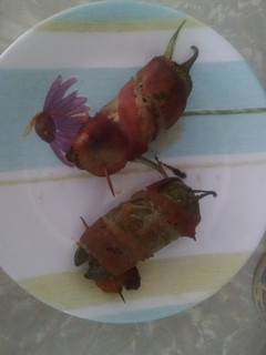 A picture of Bacon wrapped stuffed jalapeños.