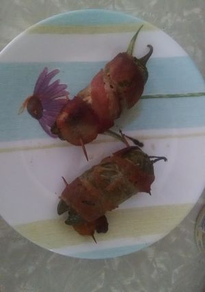 A picture of Bacon wrapped stuffed jalapeños.