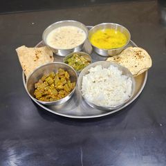 A picture of Maharashtrian Thali For Lunch -Fry Bhindi, Bhhat,Varan, Kharda, Chapati, Kheer.