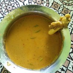 A picture of Melagu Aati vecha mutton kolambu.