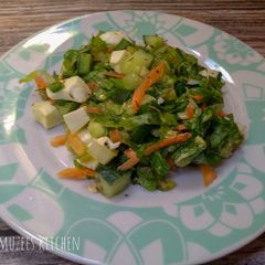 A picture of Salad with Homemade dressing.