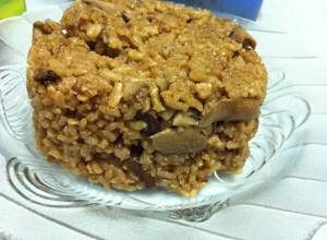 Pumpkin leaves cooked in peanut butter is seen in a clay pot at a