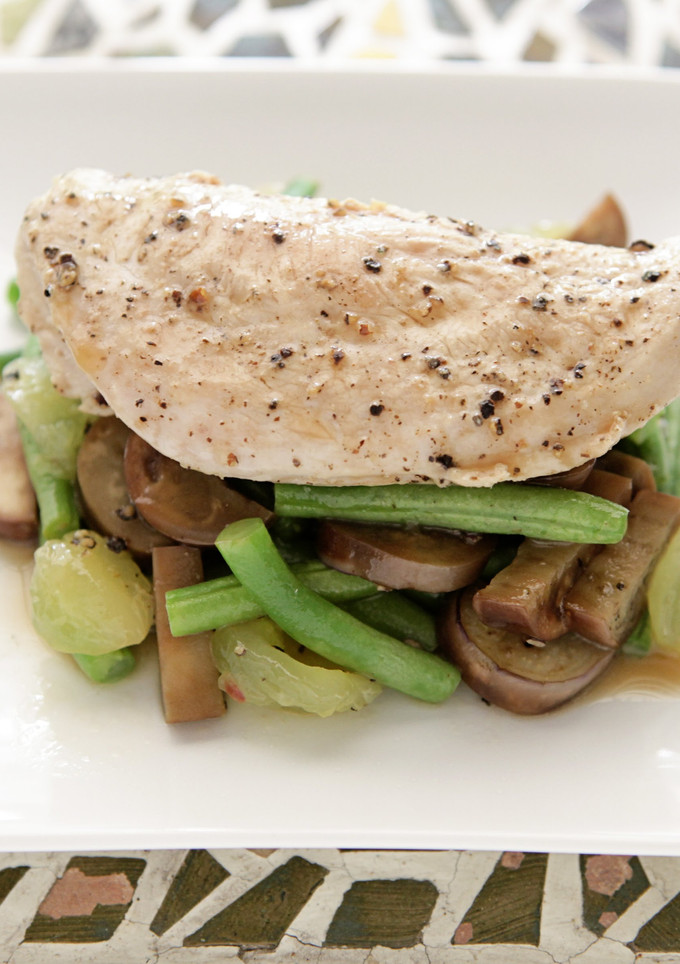 A picture of Pan Seared Chicken with Green Bean, Japanese Eggplant, and Muscadine Sauté.